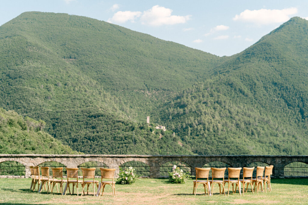 Wedding ceremony space overlooking the valley with chairs, Abbazia San Pietro in Valle wedding, image taken by Kelley Williams a wedding photographer in Umbria Italy