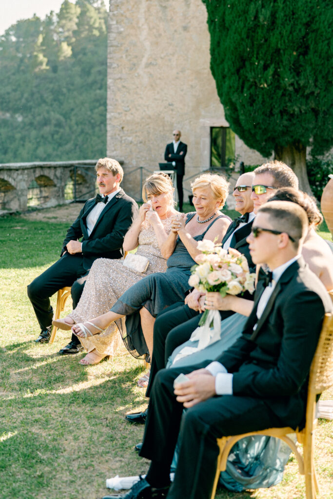Wedding guests crying during the ceremony, Abbazia San Pietro in Valle wedding, image taken by Kelley Williams a wedding photographer in Umbria Italy