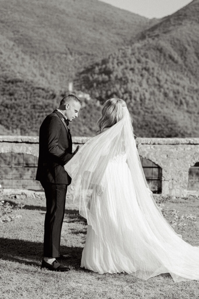 A black and white photo of the bride and groom during the ceremony, Abbazia San Pietro in Valle wedding, image taken by Kelley Williams a wedding photographer in Umbria Italy