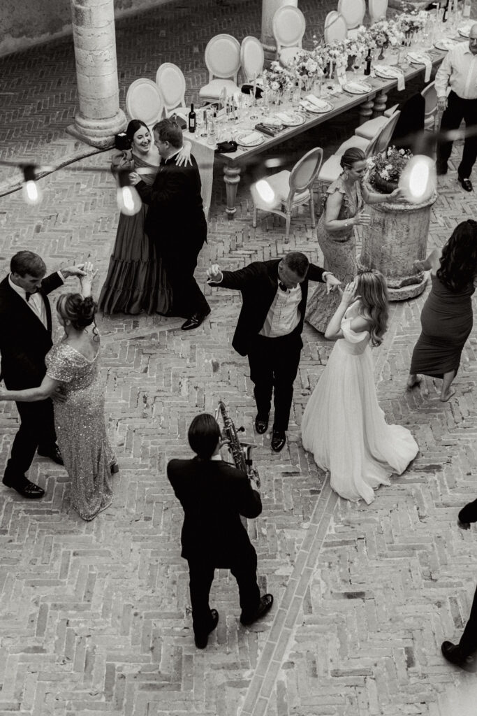 Overhead shot of all the guests on the dance floor, Abbazia San Pietro in Valle wedding, image taken by Kelley Williams a wedding photographer in Umbria Italy