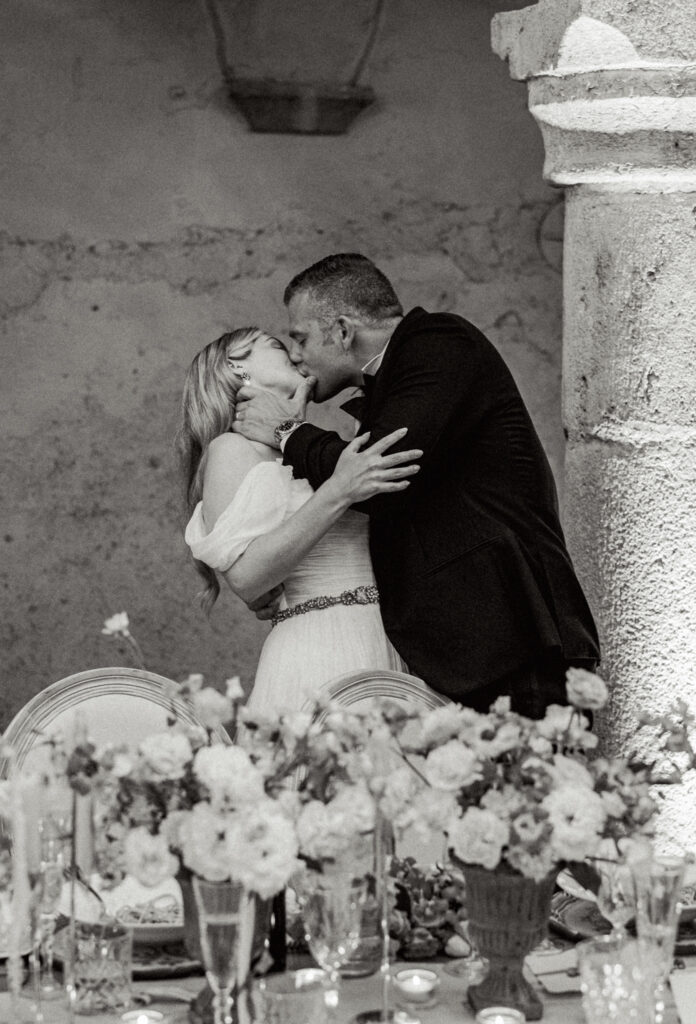 The bride and groom in a passionate kiss, Abbazia San Pietro in Valle wedding, image taken by Kelley Williams a wedding photographer in Umbria Italy