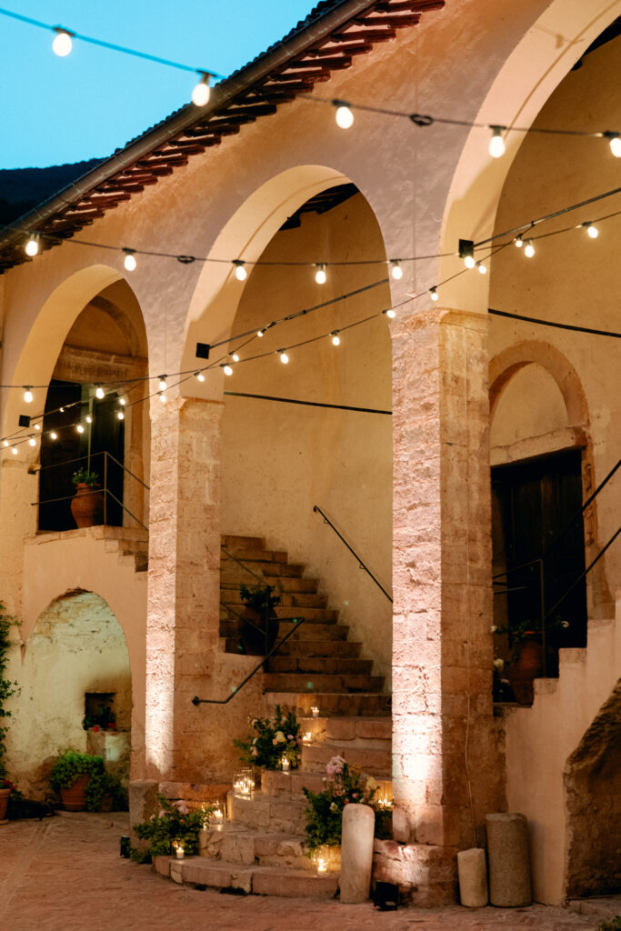 An evening photo of the staircase, Abbazia San Pietro in Valle wedding, image taken by Kelley Williams a wedding photographer in Umbria Italy