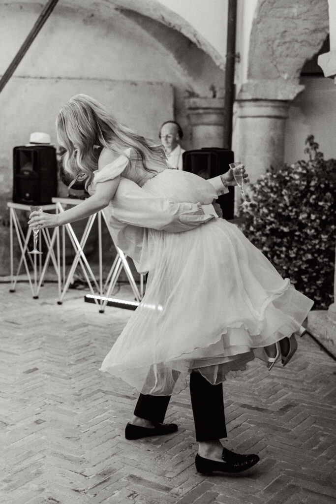 The bride and groom dancing, Abbazia San Pietro in Valle wedding, image taken by Kelley Williams a wedding photographer in Umbria Italy
